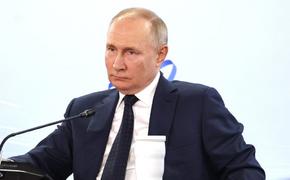 Путин впервые посетил свой избирательный штаб